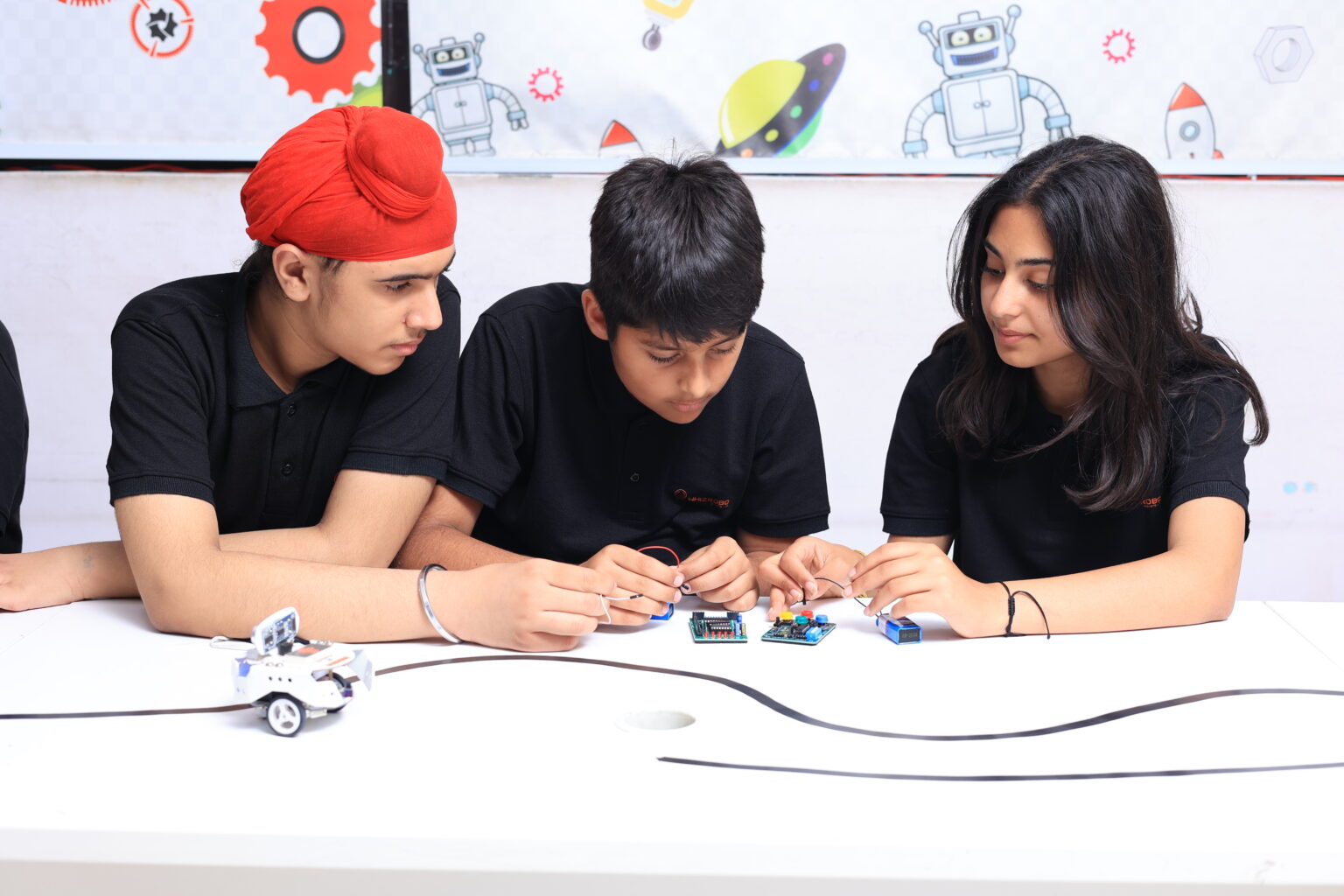 Students actively working in the WhizRobo lab